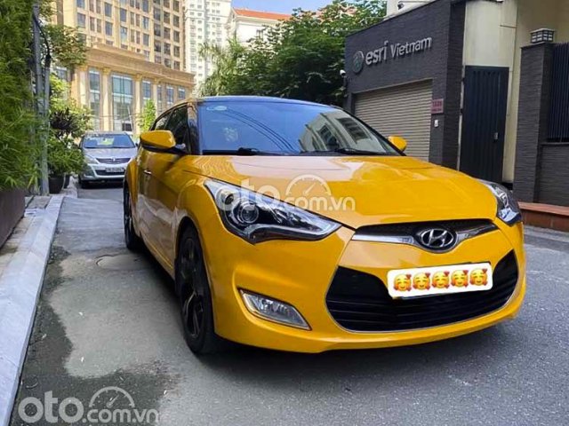 Xe Hyundai Veloster năm sản xuất 2011, màu vàng, nhập khẩu nguyên chiếc0