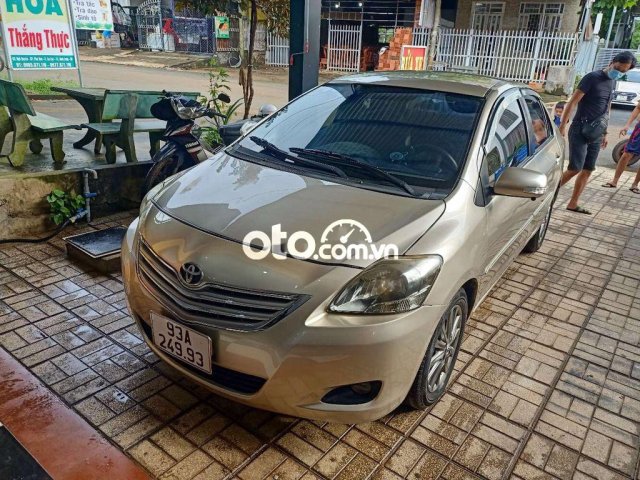 Bán Toyota Vios E năm sản xuất 2013, màu vàng cát0