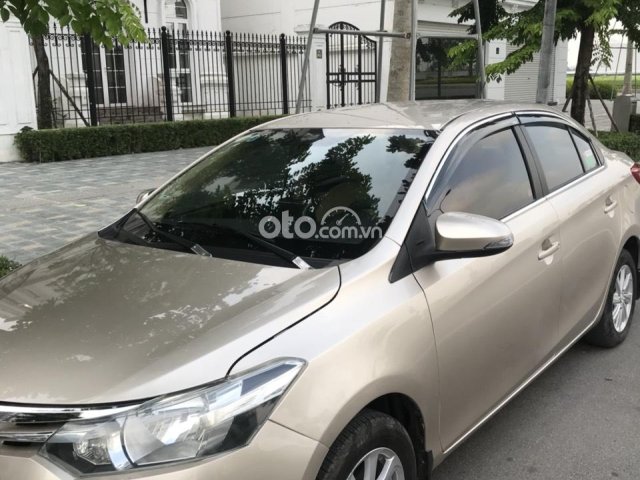 Bán ô tô Toyota Vios đời 2015, màu vàng cát xe gia đình