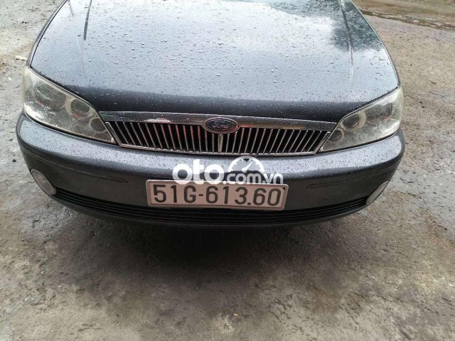 Cần bán gấp Ford Laser sản xuất năm 2002, màu xám, xe nhập0