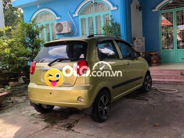 Bán ô tô Chevrolet Spark đời 2009, màu vàng  0