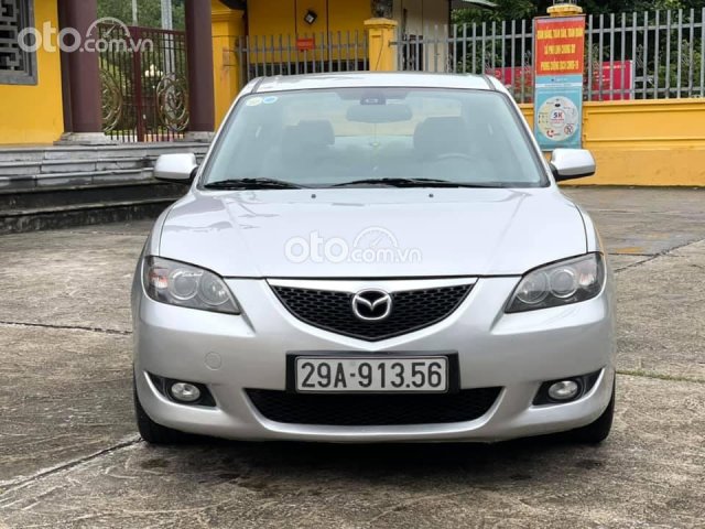 Cần bán Mazda 3 đời 2004, màu bạc số tự động0