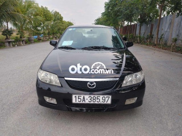 Cần bán lại xe Mazda 323 sản xuất năm 2004, màu đen, giá 150tr0