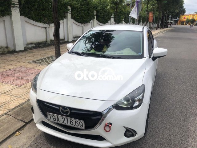 Cần bán xe Mazda 2 1.5AT 2016, màu trắng chính chủ 0