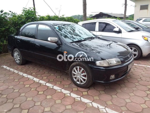 Bán ô tô Mazda 323 đời 2000, màu đen, xe nhập