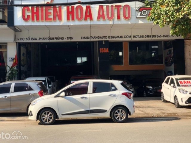 Bán xe Hyundai Grand i10 1.2 AT sản xuất năm 2015, màu trắng, nhập khẩu nguyên chiếc còn mới