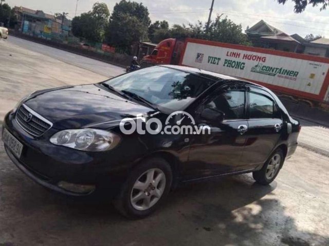 Cần bán lại xe Toyota Corolla Altis G năm 2004, màu đen0