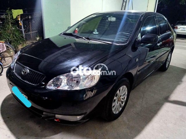 Cần bán Toyota Corolla 1.8E MT năm 2004, màu đen