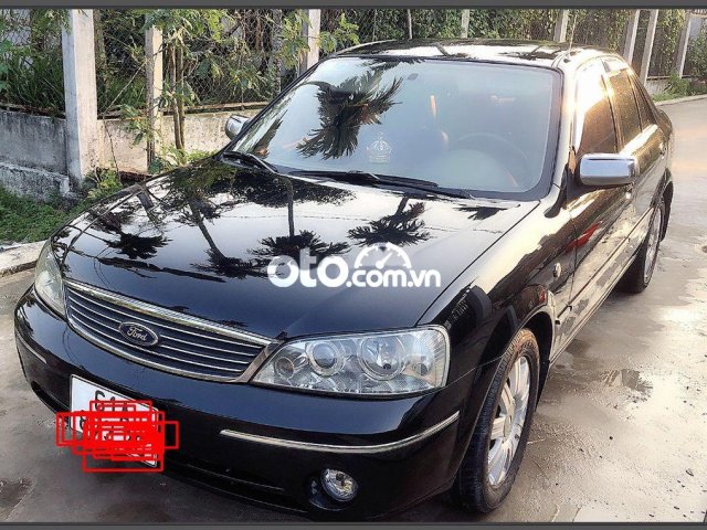 Cần bán gấp Ford Laser MT sản xuất 2004, màu đen