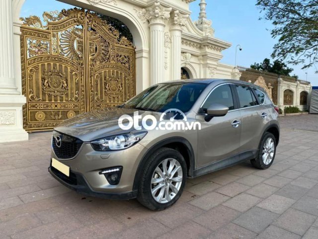 Xe Mazda CX-5 2.0 Deluxe năm 2014, màu vàng cát giá tốt0