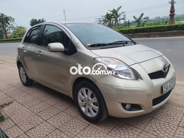 Xe Toyota Yaris sản xuất năm 2010, màu vàng, 350 triệu