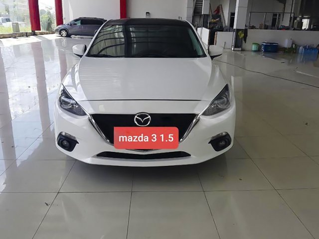 Cần bán xe Mazda 3 1.5 AT sản xuất 2015, màu trắng, 455tr0