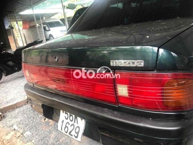 ban xe mazda 323 mau xanh, sx 1995, xe tot ko